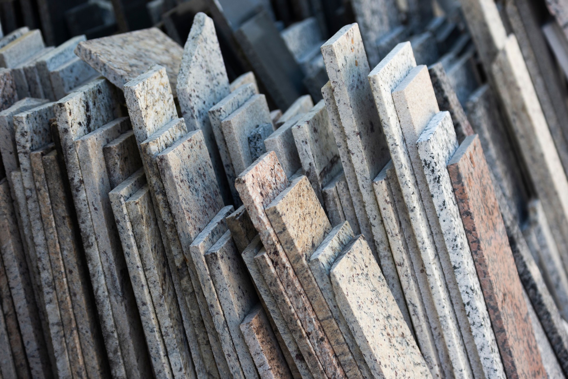 Various granite slabs stacked for construction projects.